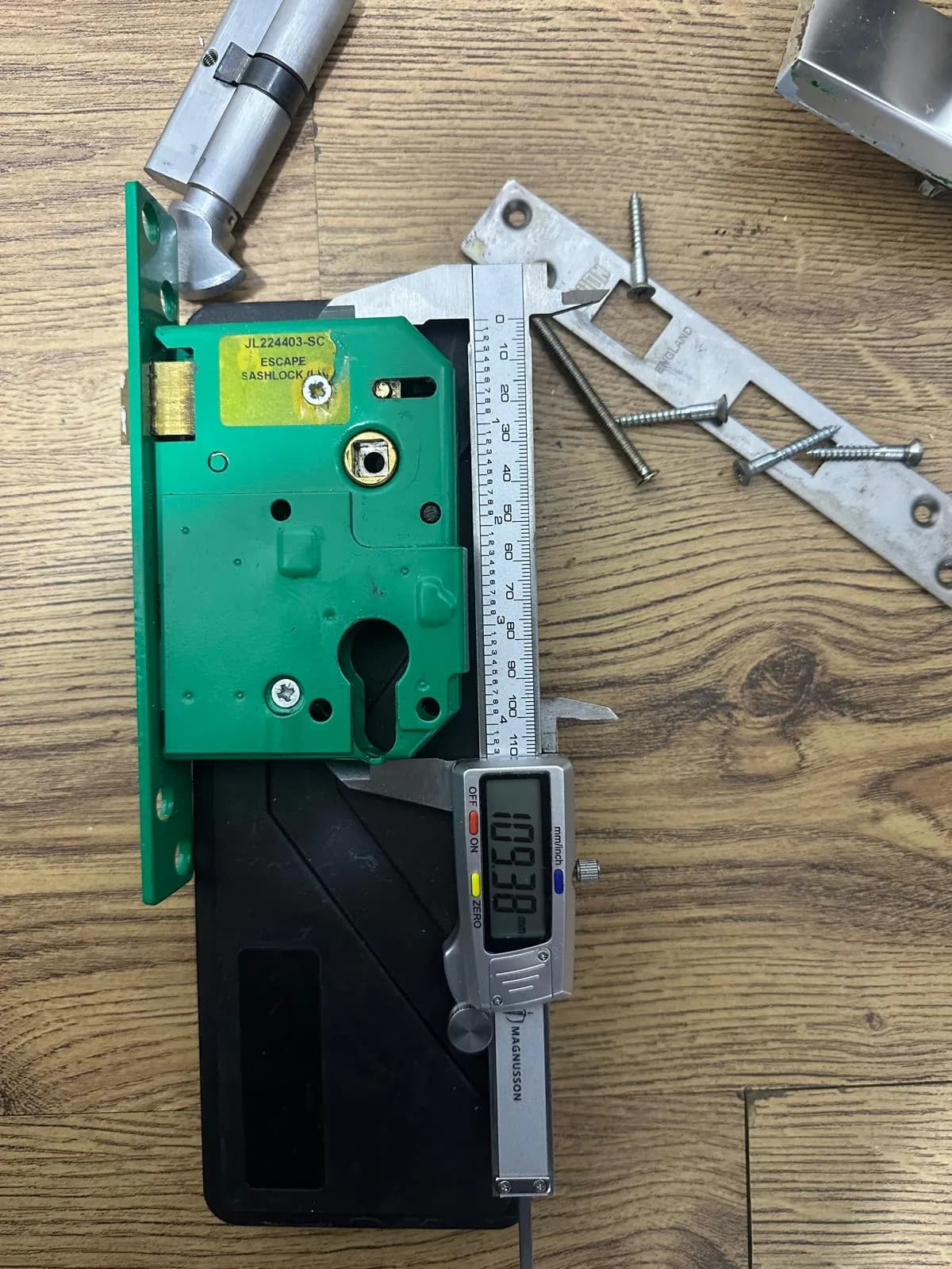 Lock case measured with a tool on a work surface